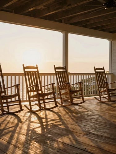 Wide angle panoramic view of a sunlit wooden porch at golden hour, empty rocking chairs, soft shadows, warm inviting light.