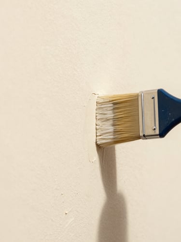 Extreme close-up of a perfectly straight paint line being cut with a pristine brush on a warm cream wall, sharp focus, 35mm lens.