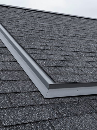 Tight architectural detail shot of flawless charcoal asphalt shingles meeting clean gray metal flashing, sharp focus, early morning daylight
