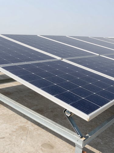 Slightly overhead structured shot of industrial monocrystalline solar panels installed on a metal rack, clear bright daylight, clean organized composition, neutral colors, 35mm lens