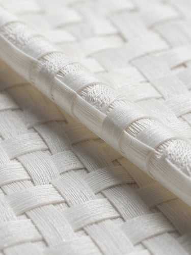 Macro photographic studio shot of white woven polypropylene fabric, showing high-precision interlocking geometric weave texture under high-contrast clean lighting.
