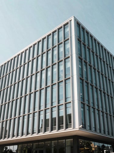 Wide architectural angle of a modern minimalist corporate building facade in Wilmington, clean steel and glass lines, bright cool daylight, high clarity.