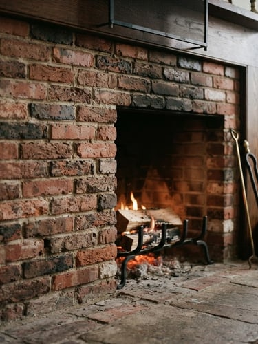 Close-up of a clean, well-maintained brick hearth with a subtle fire glowing, warm interior light, focus on the texture of the brick, traditional New England home style.