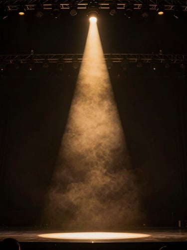 Dramatic low-angle shot of a grand concert stage, a single golden spotlight beam cutting through the haze, high contrast, deep shadows, cinematic atmosphere.