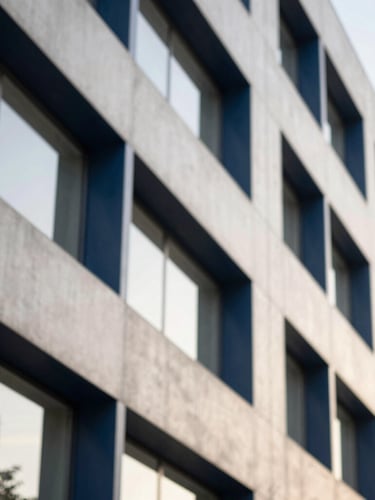 Abstract corporate architectural lines representing structure and institutional safety, clean concrete and steel angles under soft natural daylight, shallow depth of field, 35mm