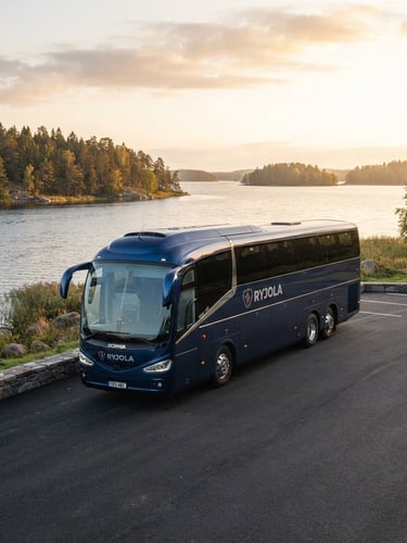 Crisp commercial vehicle photography of a modern dark blue RYJOLA charter bus parked at a scenic Baltic lakeside during morning golden hour, sharp focus, 35mm lens