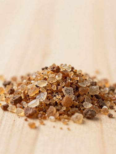 Close-up of sendha namak crystals on a light wooden surface, soft natural morning light, beige and earthy brown tones, shallow depth of field, 35mm