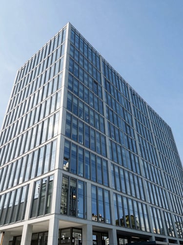 Wide-angle architectural photography of a modern glass corporate headquarters in Zurich, sharp geometric lines, bright cool daylight, blue sky reflections, clean corporate aesthetic.