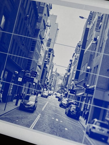Macro close-up of a high-resolution screen showing dense semantic segmentation bounding boxes over a city street scene, electric blue and slate gray interface, sharp focus.