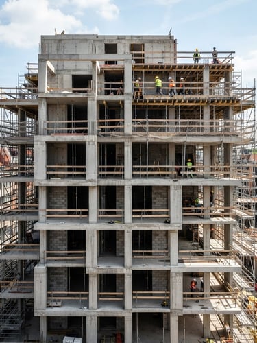 Crisp architectural photography of a modern Belgian residential building under construction, clean concrete lines, bright natural daylight, sharp focus, 35mm lens