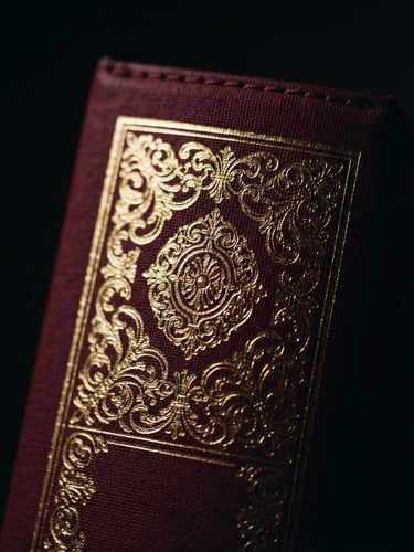 Macro close-up of a premium hardback book spine with embossed gold foil lettering, low-key dramatic studio lighting, deep crimson accents, 35mm