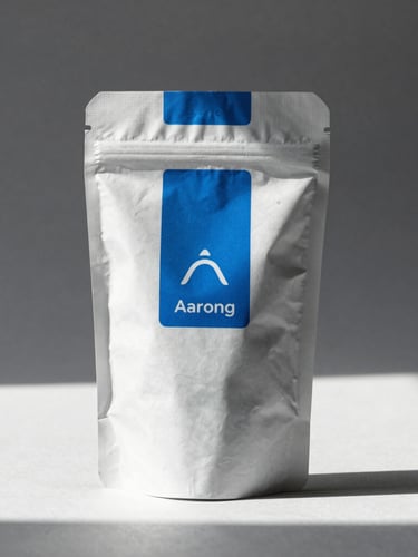 Close-up of premium physical packaging for Aarong Crafts, harsh direct sunlight, sharp shadows, minimalist studio background, electric blue accents, 35mm lens