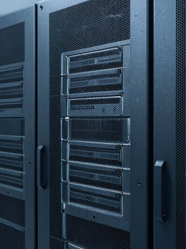 Sleek industrial photography of clean server racks in a data center, cool blue and slate gray tones, sharp studio lighting, macro hardware details, 35mm