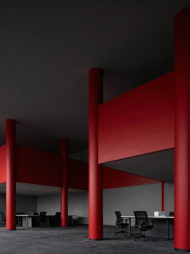Sharp editorial photography of a modern collaborative workspace, dynamic architectural angles, deep crimson highlights, high contrast studio lighting