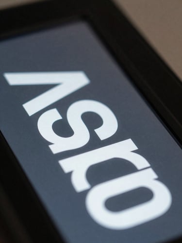 Extreme close-up of typographic details on a digital matte display, cool graphite and white contrast, technical precision.