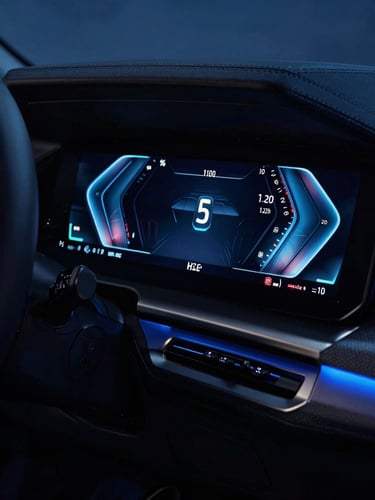 Close-up of a glowing BMW digital instrument cluster in a dark cabin, sharp electric blue ambient lighting, high-tech dashboard display, sleek automotive photography