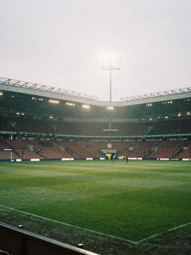 Stadium floodlights cutting through evening mist at a local London football ground, gritty high-contrast 35mm film style