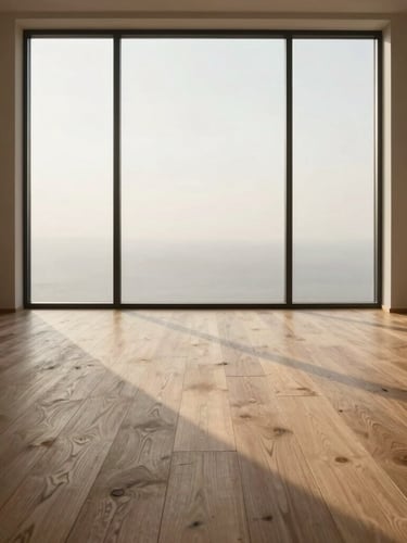 Architectural vertical shot of wide-plank oak flooring extending toward a large floor-to-ceiling window, soft morning light casting long shadows, minimalist interior
