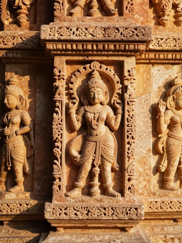 Close-up of intricate Rajasthani stone carvings on a sandstone pillar, warm golden-hour sunlight casting soft shadows, 35mm