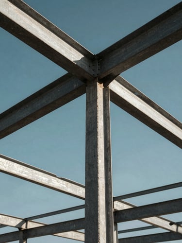 Low-angle hero shot of structural steel framing against high-contrast Botswana sunlight, highlighting raw concrete and steel textures.