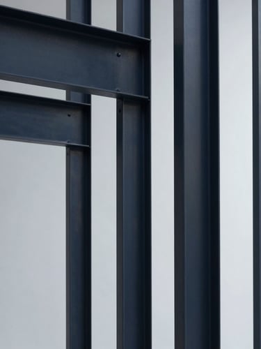 Minimalist architectural photography of clean steel structures, cool crisp studio lighting, sharp focus, 35mm
