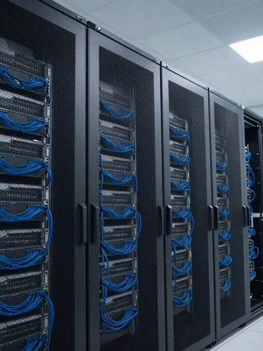 Wide angle, crisp technical photography of a modern, clean server room with tidy electric blue cabling, cool slate tones, sharp focus, professional office lighting.