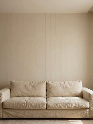 Straight-on architectural elevation of a minimalist apartment living room, warm cream fluted wood paneling, low-slung beige linen sofa, soft natural window light, 35mm lens