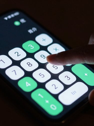 Extreme close-up of a hand tapping a high-fidelity Android screen showing a clean, dark-mode calculator app with vibrant mint green accents, moody low-key ambient lighting, 50mm