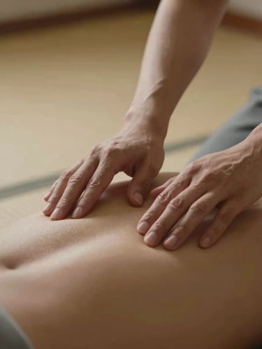 A close-up shot of hands gently adjusting a practitioner's spinal alignment on a soft tatami mat, warm side-lighting highlighting joint posture, minimalist background.