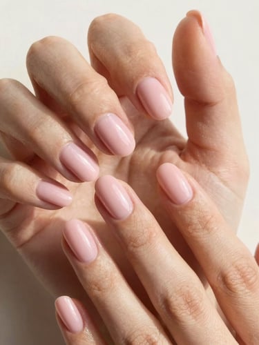 Extreme close-up of perfectly manicured hands with soft pink BIAB nails, elegant hand pose, warm white background, soft natural daylight, macro lens