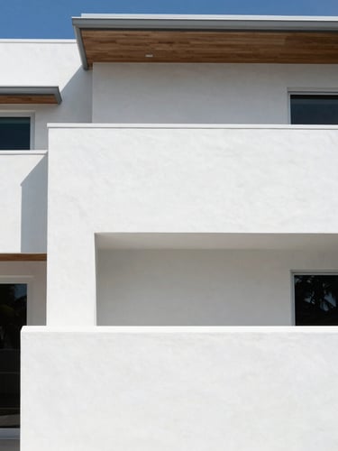Crisp architectural photography of a modern Boca Raton waterfront villa, sharp midday coastal daylight highlighting flawless white stucco walls and clean shadow lines, high-contrast minimal composition.