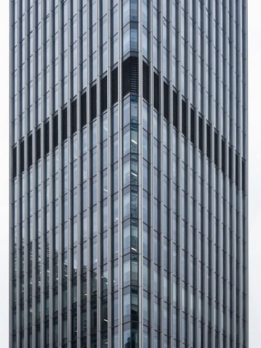 Sleek architectural photography of a commercial high-rise interior, cool high-key studio lighting, sharp focus, 35mm