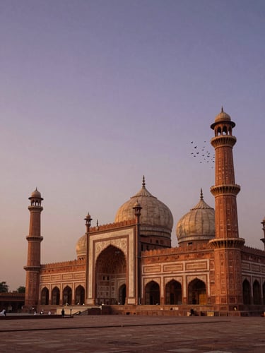 Panoramic dusk view of Badshahi Mosque in Lahore, warm amber and deep purple sky fading behind the Mughal domes and minarets, a flock of birds lifting from the right minaret, soft ambient ground lighting catching the carved sandstone façade, wide environmental frame with the mosque placed right of center and open sky dominating the left third