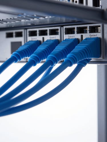Macro photograph of heavy-duty blue fiber-optic cables entering a server rack, cool high-key studio lighting, technical minimalism, 50mm