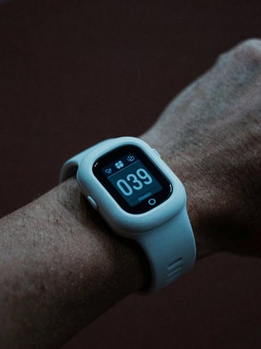 Macro close-up of a premium wearable telemetry device on an athlete's wrist, cool-toned surgical blue light, dark charcoal background, moody shadows, 35mm film.