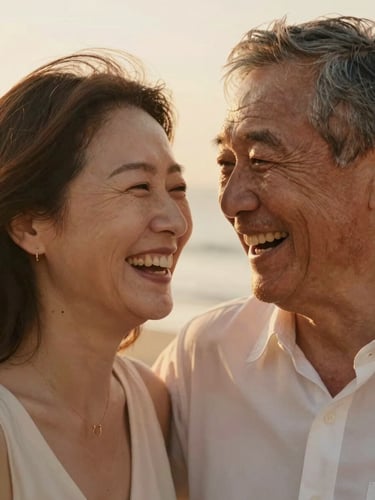 Close-up portrait of a mature couple laughing naturally, soft golden-hour light, warm editorial photography, authentic candid moment