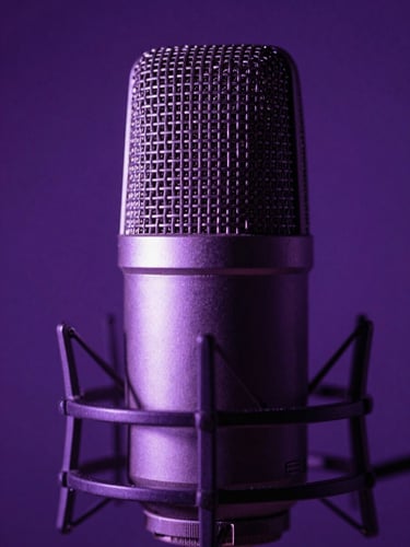 Extreme close-up of a high-end studio microphone in low-light, illuminated by a single sharp electric purple backlight with deep shadows.
