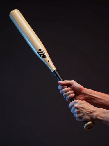 Low-angle dynamic shot of hands gripping a composite baseball bat, dramatic red and blue LED sidelighting, dark background, motion blur on the bat.