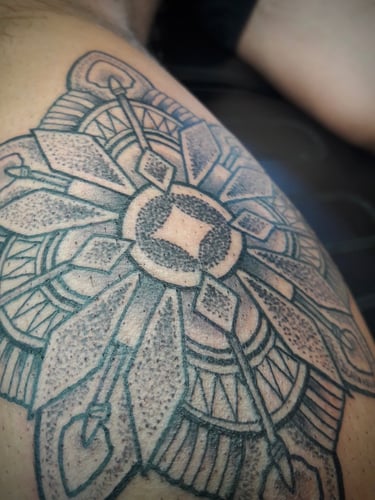 Closeup of a custom designed dotwork mandala
