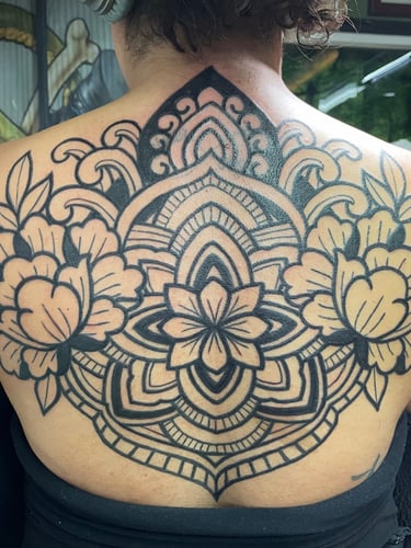 Black work Ornamental backpiece featuring peony flowers