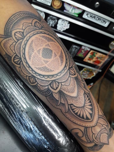 Dotwork mandala with ornamental elements