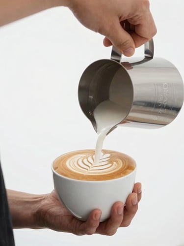 Close-up of a professional barista pouring perfect latte art in a bright, high-key minimalist studio setting, sharp focus, 50mm lens