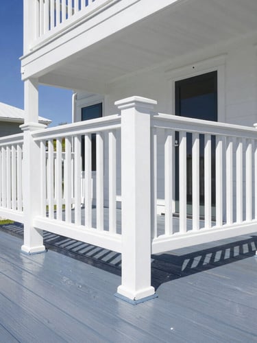 Crisp architectural detail of a pristine coastal home deck, freshly pressure washed wood contrasting with white railings, bright Florida sunlight, sharp focus
