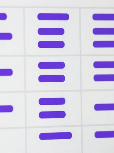 Macro close-up of structured design system documentation on a screen, clean component states, bright white and royal purple accents.