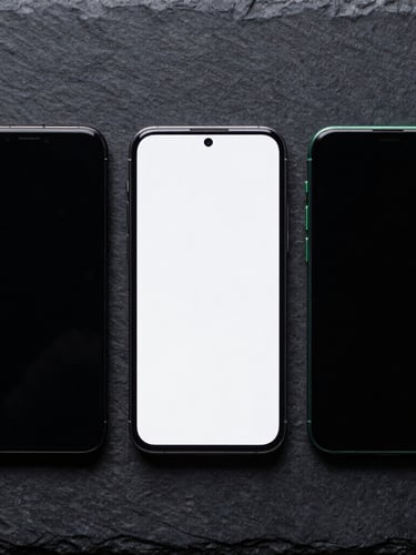 Top-down flat lay of three smartphones side-by-side on a dark slate surface, high-contrast studio lighting, subtle green rim lights