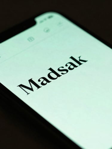Extreme close-up of UI details, moody ambient lighting with soft green screen glow, a sleek smartphone showing a distraction-free markdown editor with crisp sans-serif typography, resting on a dark textured surface