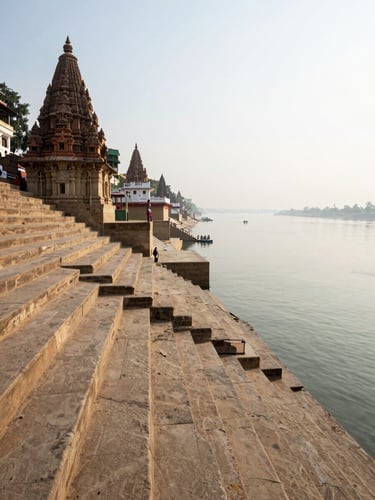 Close wide shot of ancient ghat steps descending into the Ganga, worn river-stone texture in the foreground, a distant line of temple spires along the far bank, diffused morning light, no people — only the architecture of devotion meeting water
