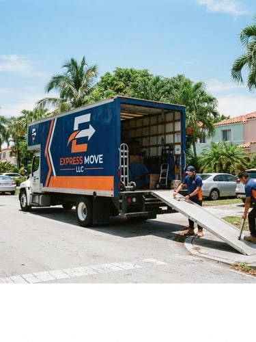 Wide shot of a clean, branded Express Move LLC moving truck parked on a sunny Hialeah street, professional movers in uniform securing a ramp, bright midday light, saturated deep blue and orange tones.