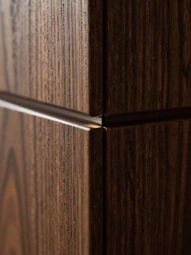 Extreme close-up of a dark oak wall joint with a completely flush, microscopic sensor slit, warm grazing light, high contrast, architectural detail