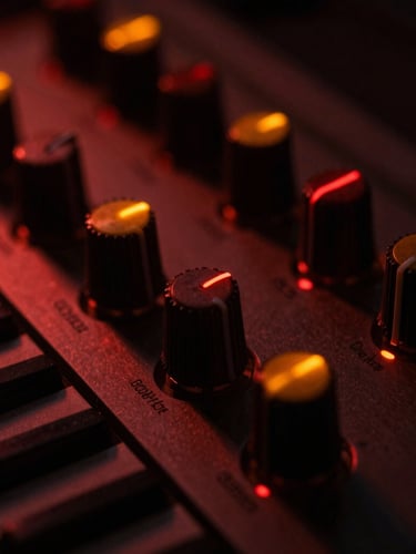 Macro photography of analog synthesizer knobs glowing with faint orange and red indicators in a dark room, metallic chassis, 35mm